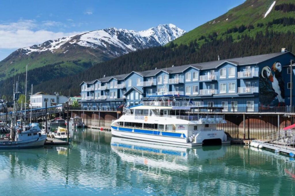 Harbor 360 hotel in Seward, AK with boats in front 